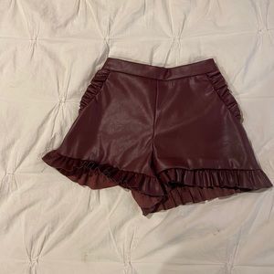 Cranberry pleather shorts